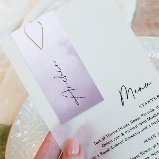 Vellum wedding menu with guest name card in lavender
