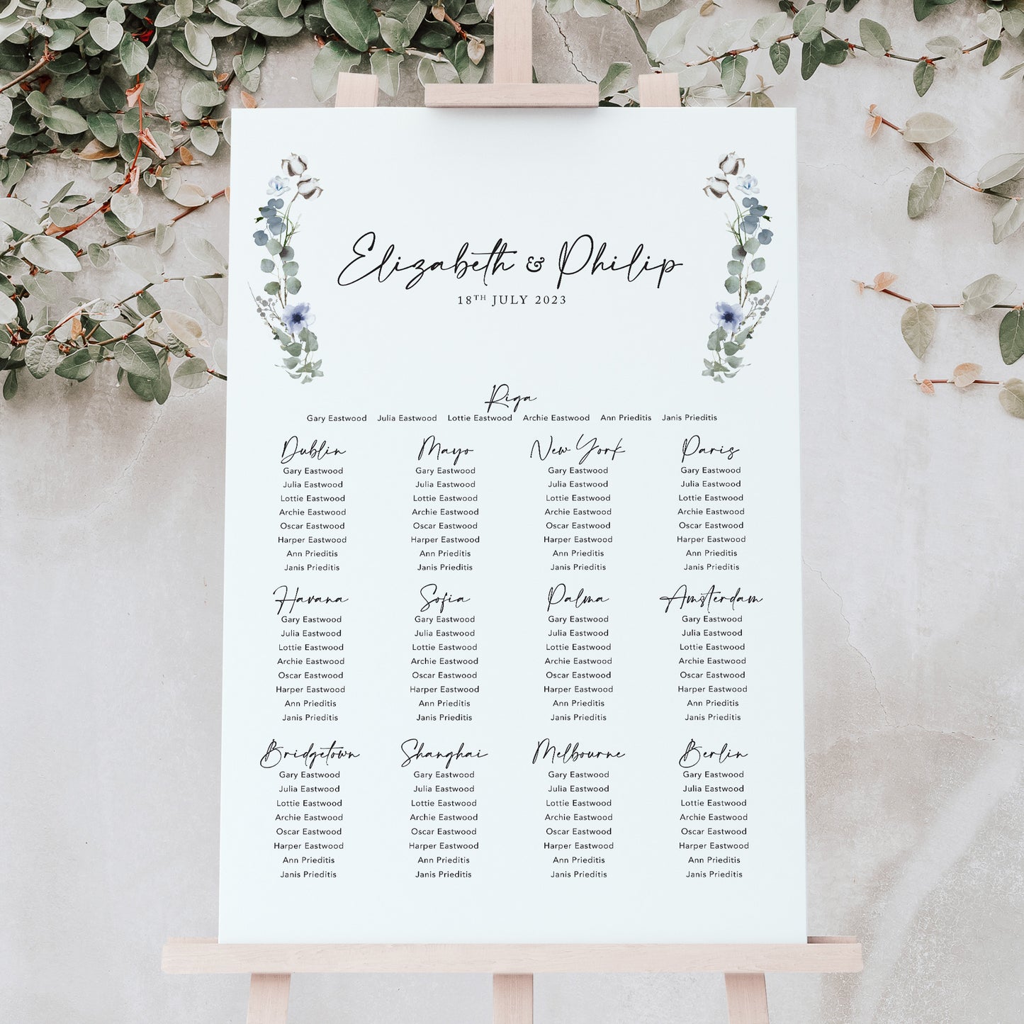 simple wedding table plan with sage green foliage