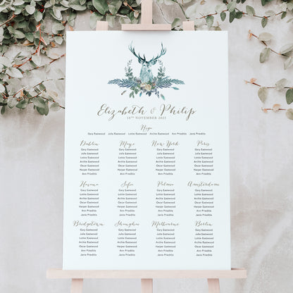 blue wedding seating chart for a winter wedding