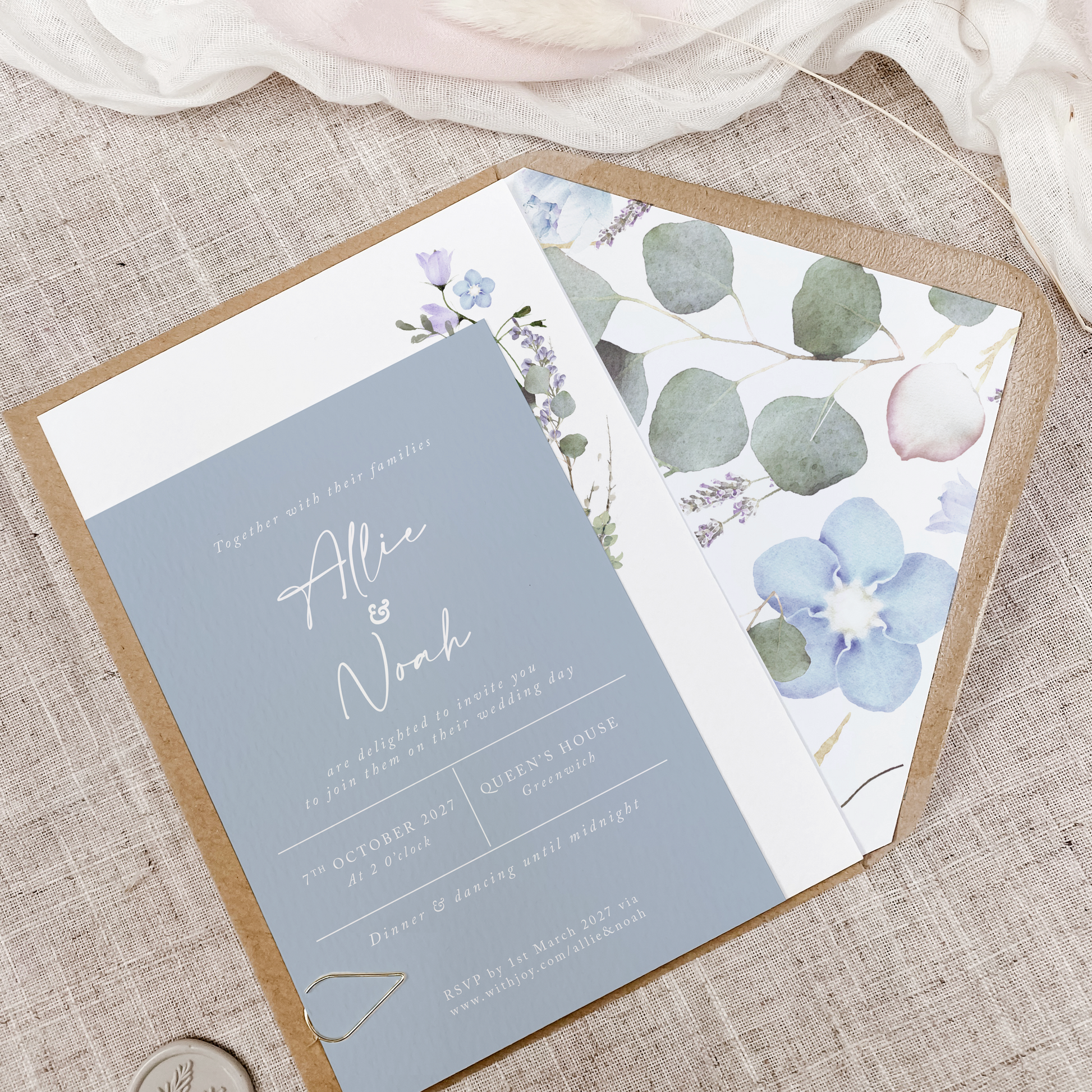 Periwinkle wedding invitation with botanical floral envelope liner, professionally printed on textured card in the UK.