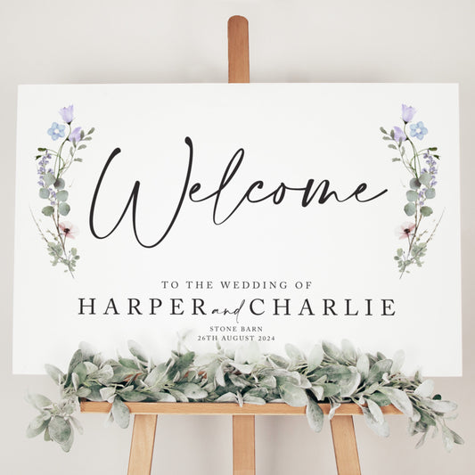 Modern and simple wedding welcome board with sage green foliage